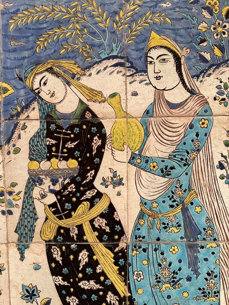 AI caption: two women in traditional clothing are standing in a tiled area, asian