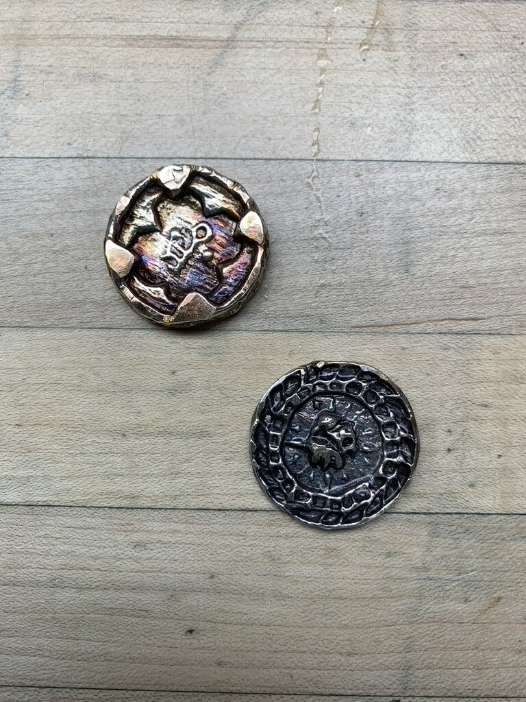 AI caption: two buttons with a flower on them, vintage