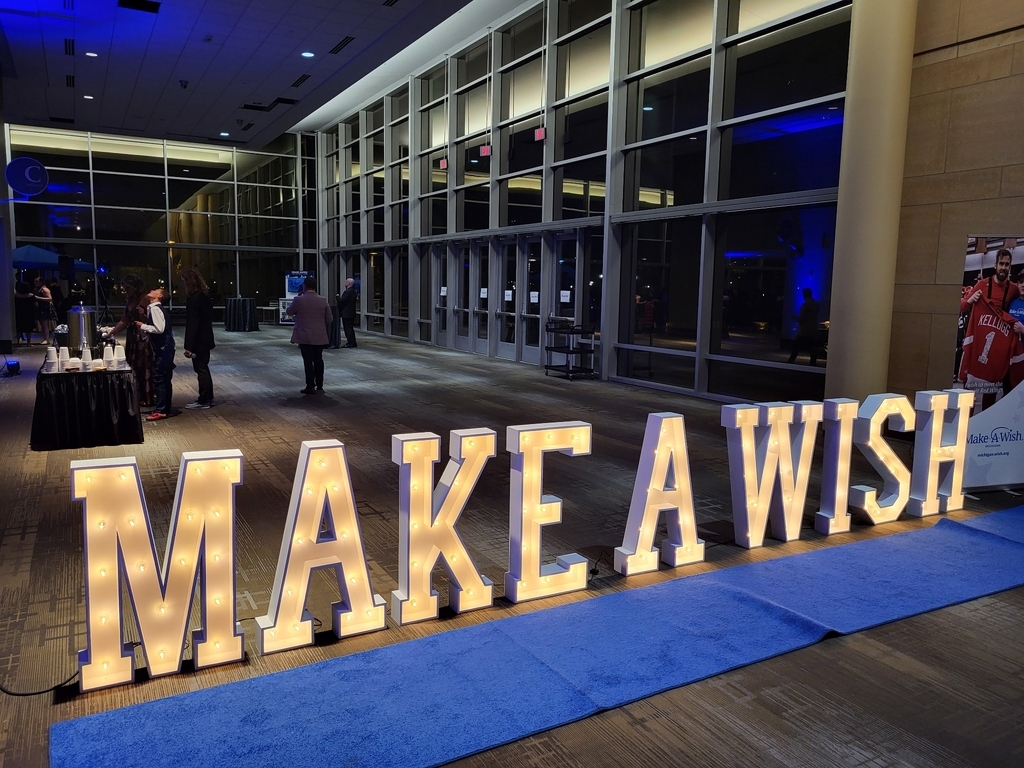 AI caption: make a wish sign in a lobby, ad