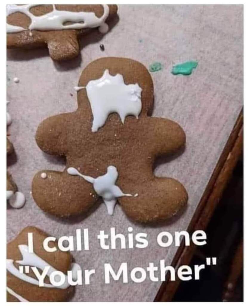 AI caption: a gingerbread man with icing on his face, text
