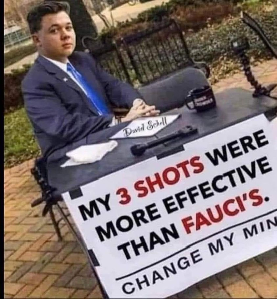 AI caption: a man sitting at a table with a sign that says 3 shots were more effective than faust change my mind, political