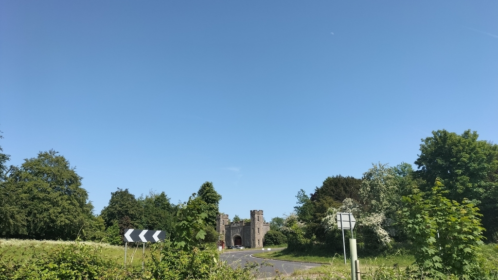 AI caption: a road with a castle in the background, landscape