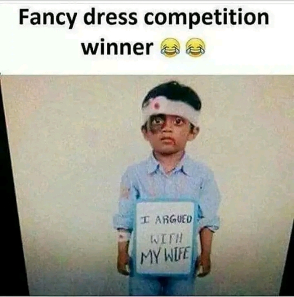 AI caption: a boy holding a sign that says fancy dress competition winner i fought my wife, meme