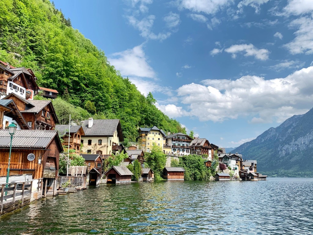 AI caption: a village on the shore of a lake, watercolor