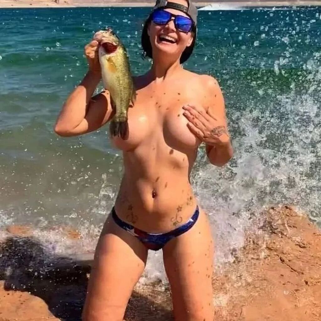 AI caption: the woman is holding a fish