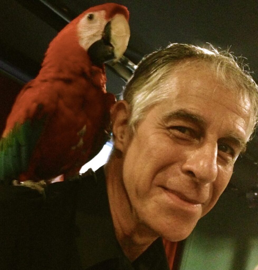 AI caption: a man with a parrot on his shoulder, black and white