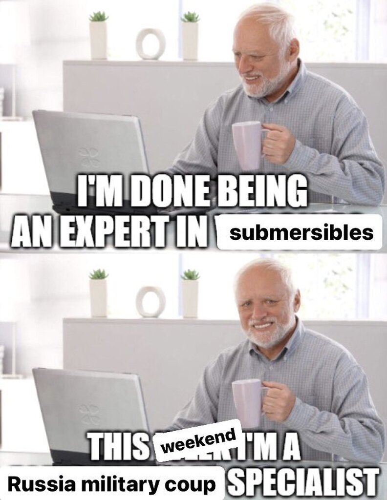 AI caption: a man is sitting at his computer with a laptop, old man