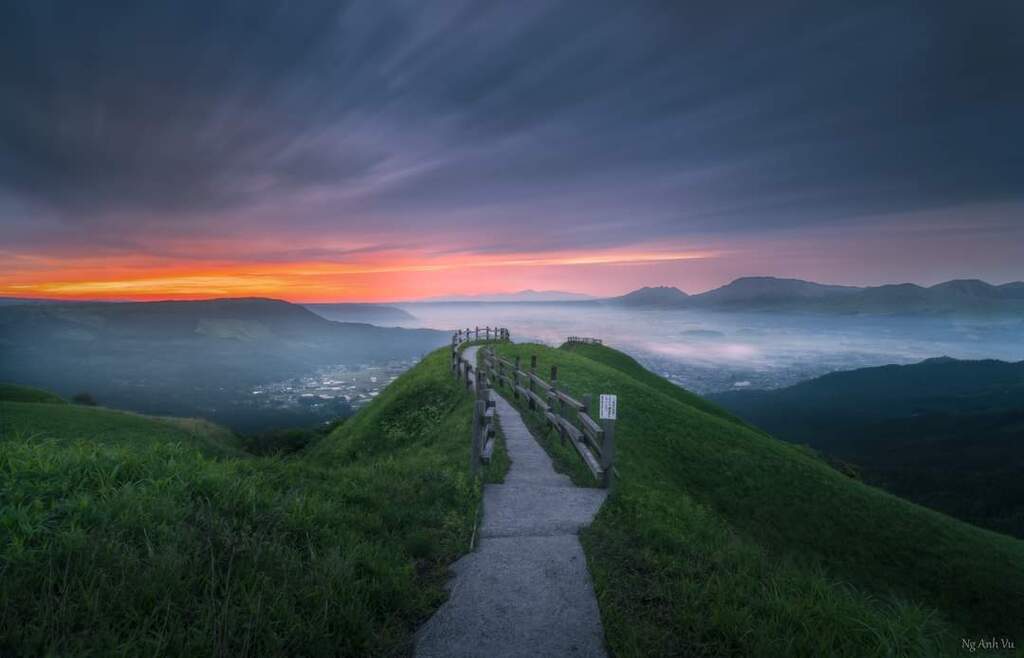 AI caption: a path leading up to a mountain at sunset, landscape