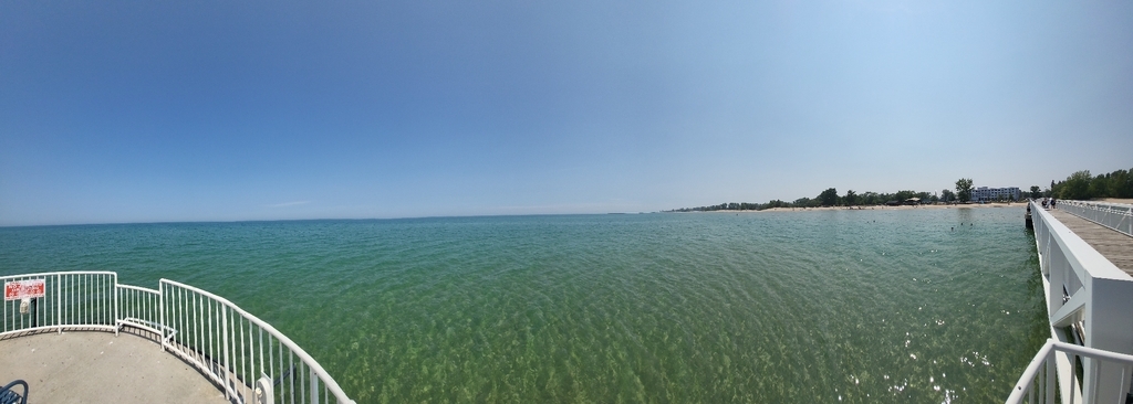 AI caption: a view of the water from the deck of a boat, panoramic