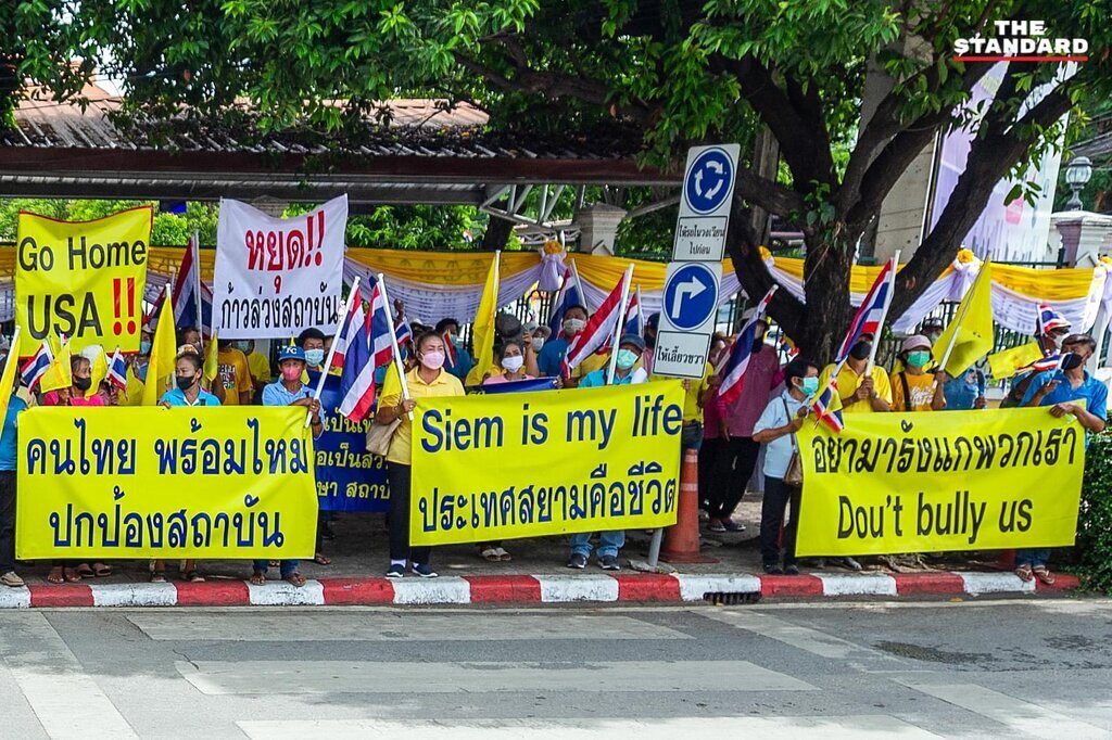 AI caption: a group of people holding signs and banners, graphic