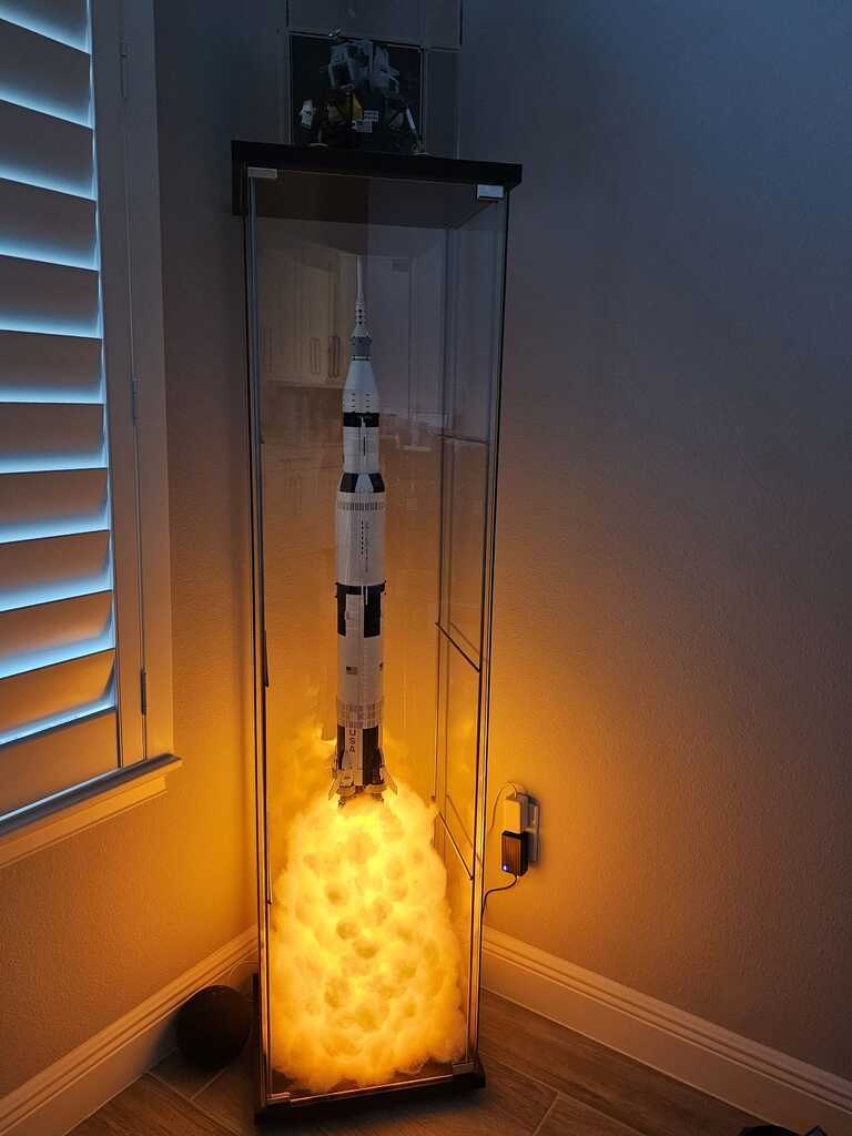 AI caption: a lego rocket in a glass case, adobe illustrator
