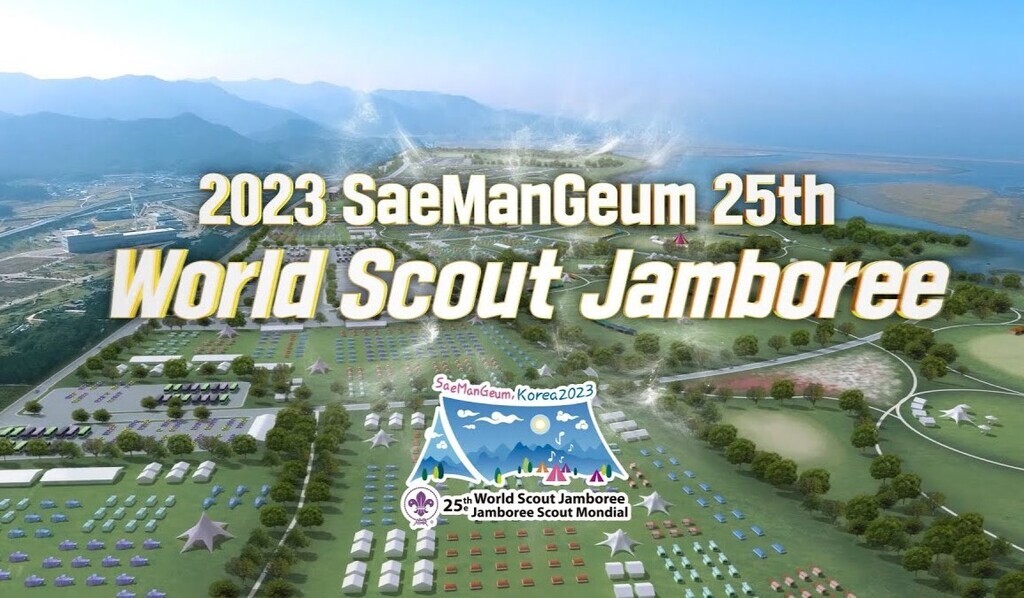 AI caption: the image is a scout camp, the image is a scout camp, aerial the world scout jamboree is shown in the background, the image is a scout camp, aerial the world scout jamboree is shown in the background, the image is a scout camp, aerial the world scout jamboree is shown in the background, the image is a scout camp, aerial the world scout jamboree is shown in the background, the image is a scout camp, aerial the world scout jamboree is shown in the background, the image is a scout camp, aerial the world scout jamboree is shown in the background, the image is a scout camp, aerial the world scout jamboree is shown in the background, the image is a scout camp, aerial the world scout jamboree is shown in the background, the image is a scout camp, aerial the world scout jamboree is shown in the background, the image is a scout camp, aerial the world scout jamboree is shown in the background, the image is a scout camp, aerial the world scout jamboree is shown in the background, the image is a scout camp, aerial the world scout jamboree is shown in the background, the image is a scout camp, aerial the world scout jamboree is shown in the background, the image is a scout camp, aerial the world scout jamboree is shown in the background, the image is a scout camp, aerial the world scout jamboree is shown in the background, the image is a scout camp, aerial the world scout jamboree is shown in the background, the image is a scout camp, aerial the world scout jamboree is shown in the background, the image is a scout camp, aerial the world scout jamboree is shown in the background, the image is a scout camp, aerial the world scout jamboree is shown in the background, the image is a scout camp, aerial the world scout jamboree is shown in the background, the image is a scout camp, aerial the world scout jamboree is shown in the background, the image is a scout camp, aerial the world scout jamboree is shown in the background, the image is a scout camp, aerial the world scout jamboree is shown in the background, the image is a scout camp, aerial the world scout jamboree is shown in the background, the image is a scout camp, aerial the world scout jamboree is shown in the background, the image is a scout camp, aerial the world scout jamboree is shown in the background, the image is a scout camp, aerial the world scout jamboree is shown in the background, the image is a scout camp, aerial the world scout jamboree is shown in the background, the image is a scout camp, aerial the world scout jamboree is shown in the background, the image is a scout camp, aerial